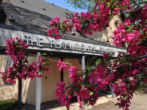 The Playwrights' Center exterior, with a flowering tree